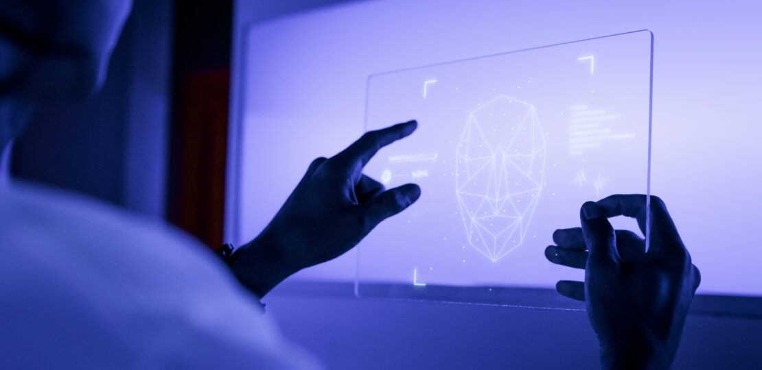 designer using a transparent digital tablet screen futuristic te